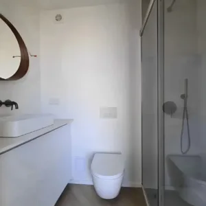 Custom container home with bathroom, kitchen, and spacious living area