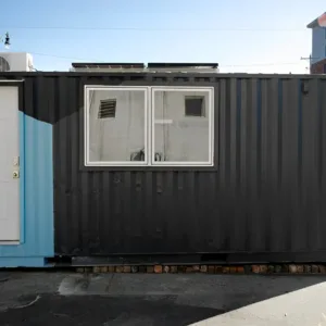 20ft container home featuring kitchenette, bathroom, and Murphy bed