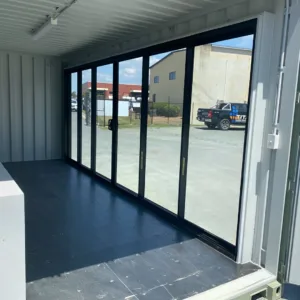 Portable 20ft container workspace with full glass frontage and climate control