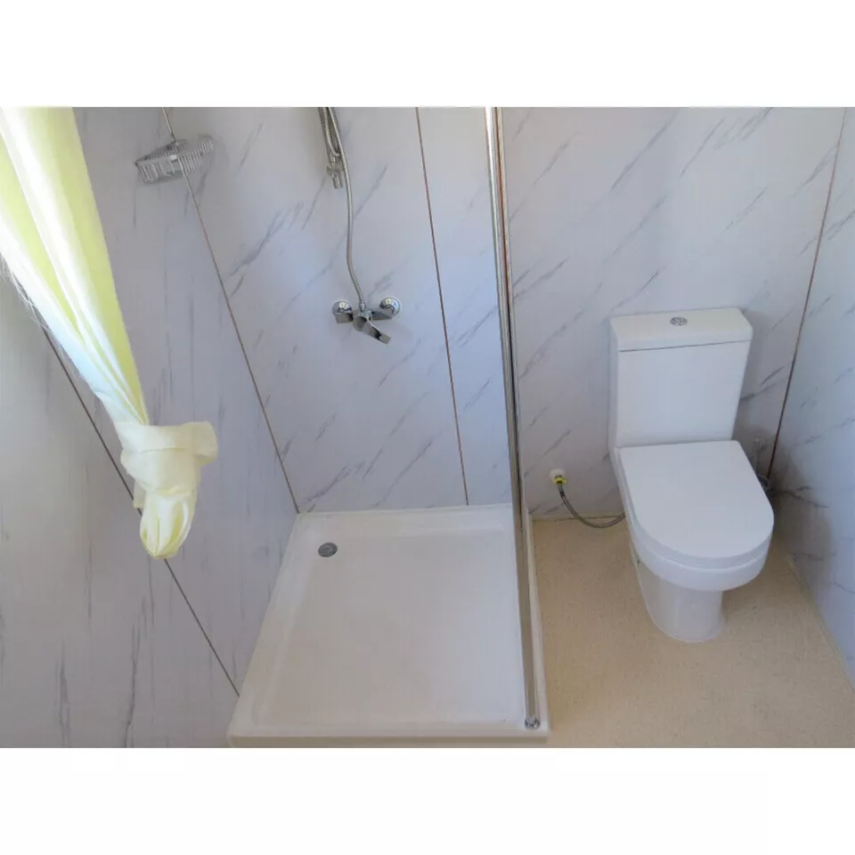 Compact mobile restroom with shower and sink for remote job sites