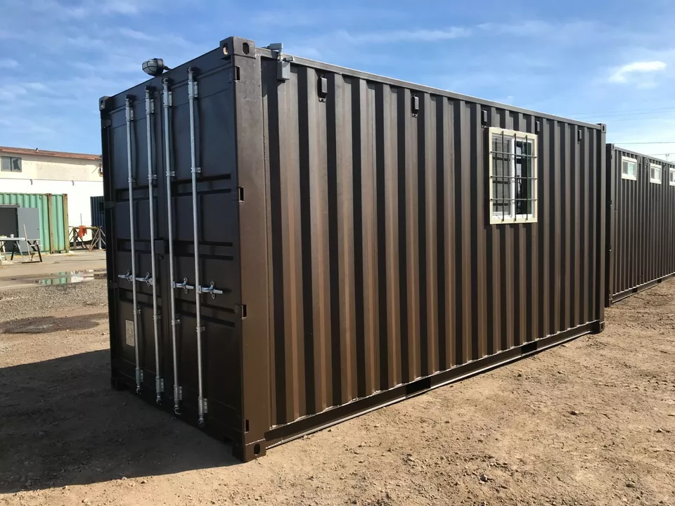Shipping container restroom with flushing toilets and HVAC system