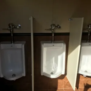 Modern shipping container restroom with sinks and hot water system