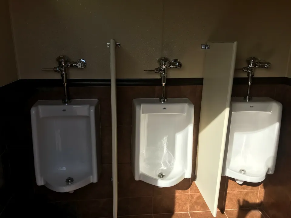 Modern shipping container restroom with sinks and hot water system