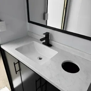 Portable bathroom trailer with freshwater tanks and waste management system