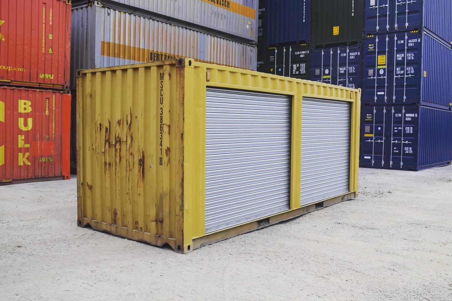 Yellow 20ft shipping container with dual side roll-up doors for secure storage