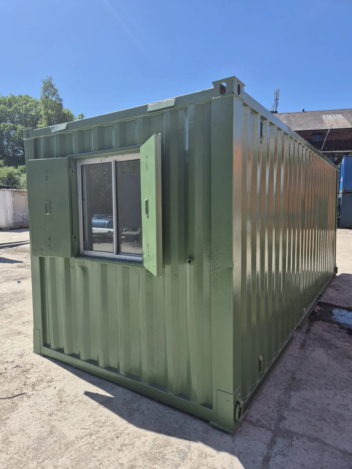 Mobile site office container with natural lighting and integrated power outlets